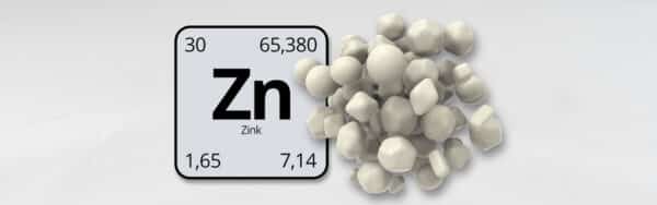 Zinktabletten neben dem Periodensymbol Zn