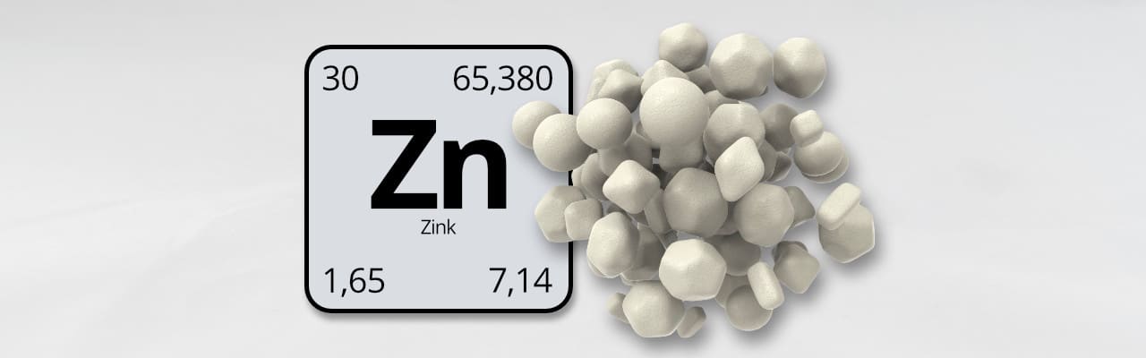 Zinktabletten neben dem Periodensymbol Zn